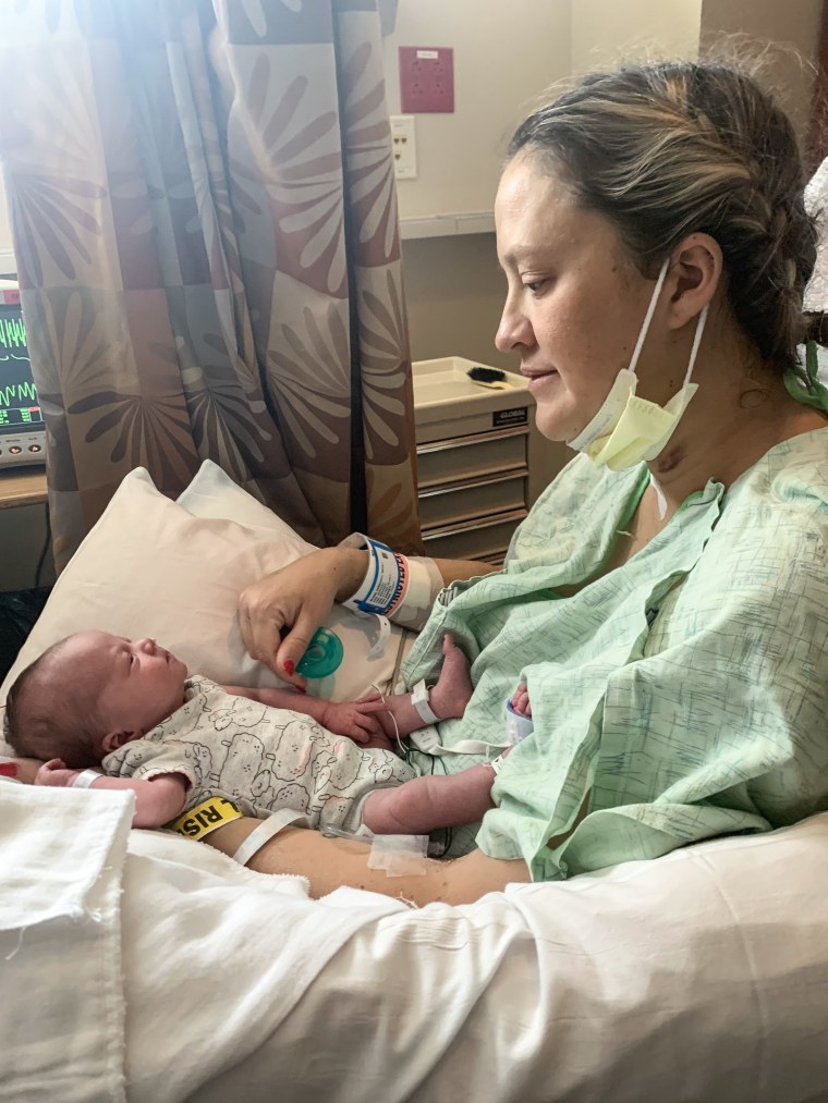 Becky Munge holds Jovie at the hospital.